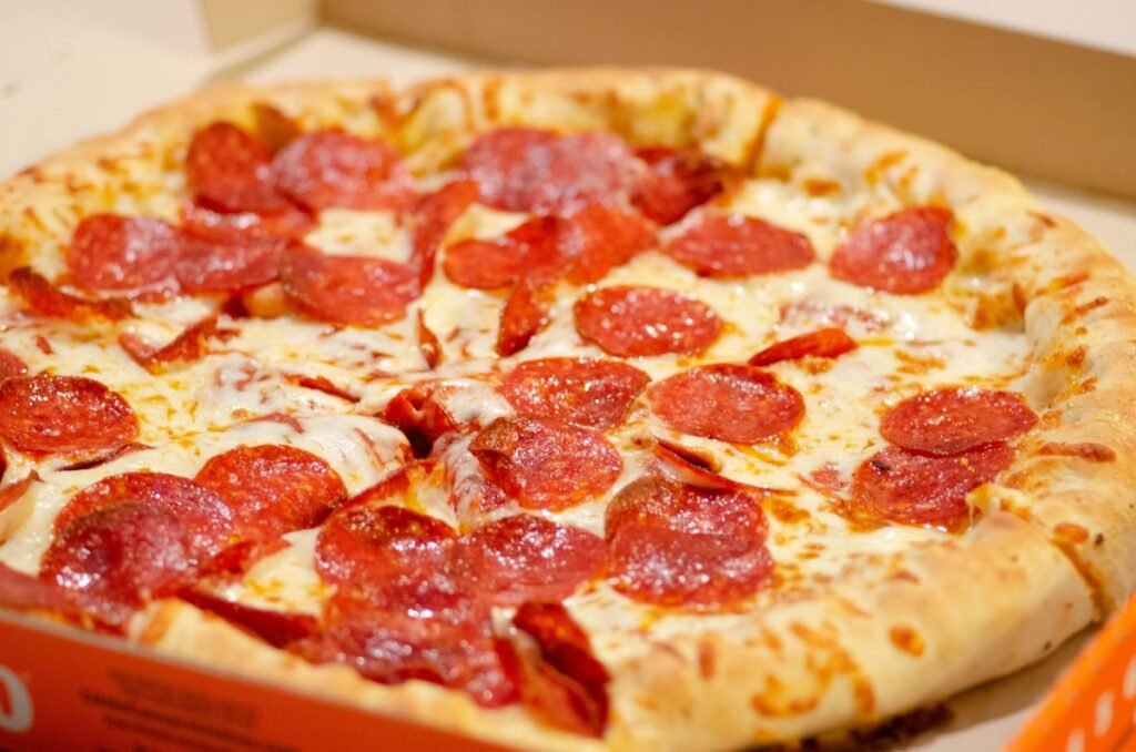 Detroit Style Pizza Recipe: How to Make It in a Pizza Oven Detroit style rectangular pizza with crispy caramelised cheese edges and sauce on top