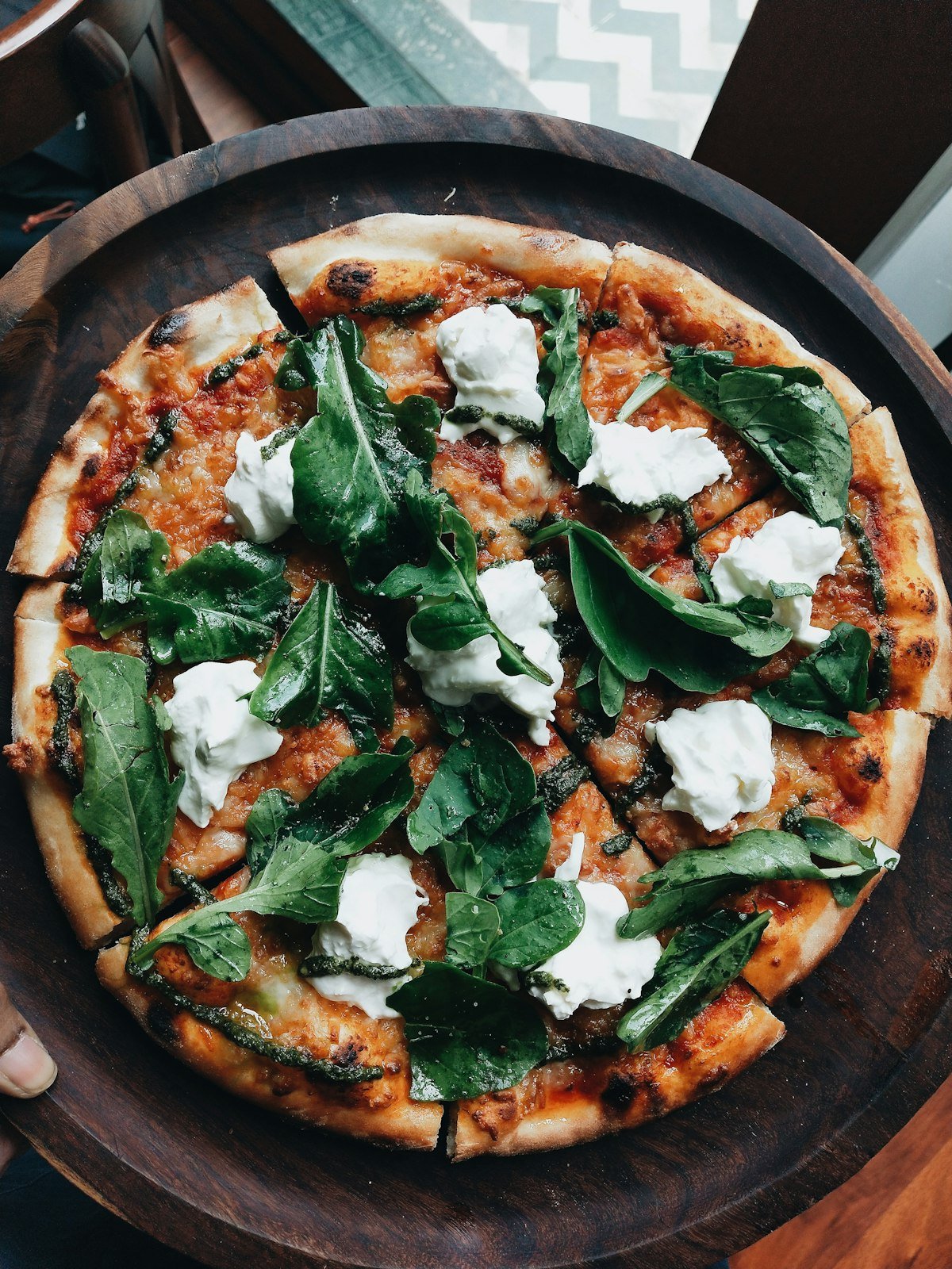How to Stretch Pizza Dough by Hand (Without Tearing It) Hands stretching pizza dough by hand