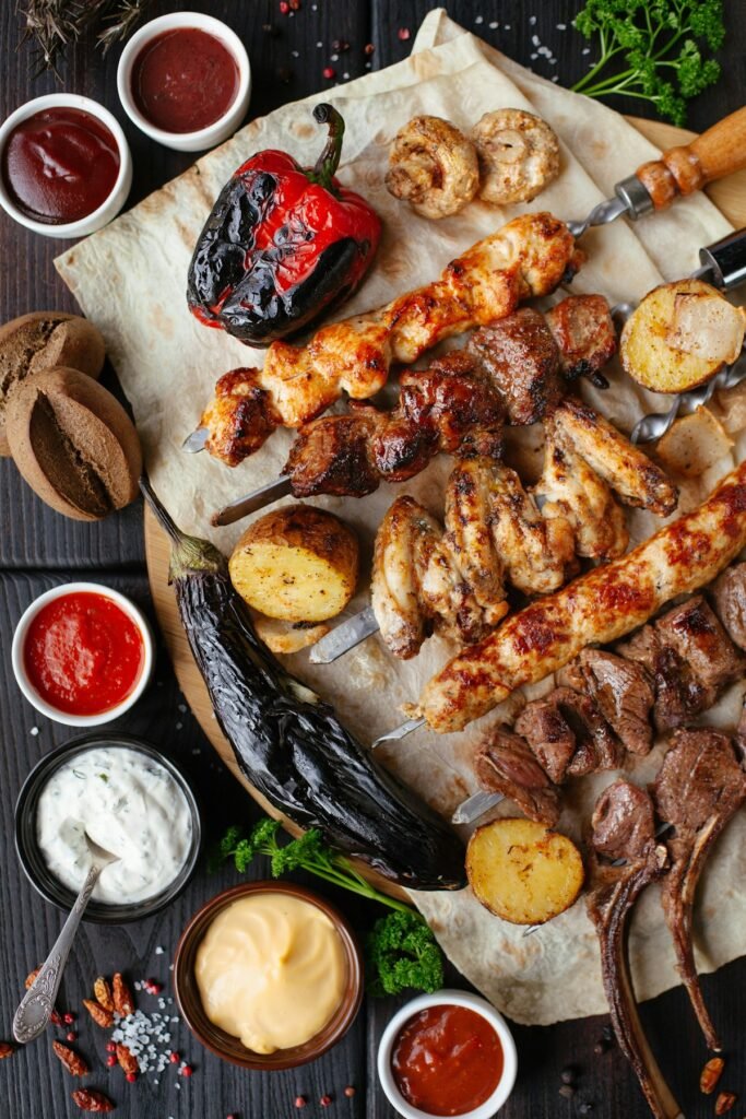 Pizza oven and BBQ side by side for outdoor cooking comparison