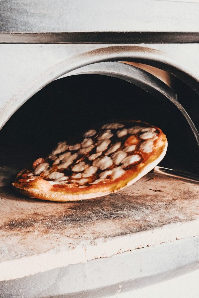 Best Pizza Stones for Home Ovens: A Buyer's Guide Pizza on stone in pizza oven